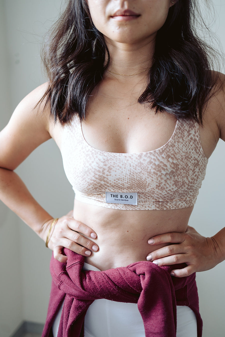 Model wearing The B.O.D (S)Naked Bralette in pink and nude, with The B.O.D Board Member label in front. Aka The Board of Directors Bra. 